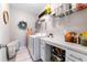 Well-organized laundry room with front loading washer and dryer and ample storage space at 1311 Arena Ln, Fuquay Varina, NC 27526