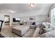 Spacious bonus room featuring a large sectional sofa, television, and carpeted floors at 1311 Arena Ln, Fuquay Varina, NC 27526
