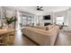 Inviting living room boasts a fireplace, ceiling fan, and sliding glass doors leading to the outdoors at 1311 Arena Ln, Fuquay Varina, NC 27526