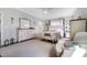 Bright main bedroom features a ceiling fan, white furniture, and ensuite bathroom at 1311 Arena Ln, Fuquay Varina, NC 27526