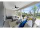 Cozy screened porch featuring comfortable seating and view of fenced backyard at 1311 Arena Ln, Fuquay Varina, NC 27526