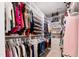 Walk-in closet with custom shelving and storage for clothes, shoes, and accessories at 1311 Arena Ln, Fuquay Varina, NC 27526