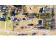 An aerial view with location pin showing a house with a spacious yard in a residential neighborhood at 1317 Long Dairy Ct, Graham, NC 27253