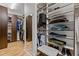 This spacious walk-in closet features custom shelving and hanging racks at 1403 Medici Ct, Cary, NC 27518