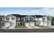 Charming new construction townhomes with individual garages, driveways, and well-maintained landscaping at 144 Parker Ln, Mebane, NC 27302