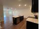 Gourmet kitchen island has a sink, stainless steel appliances, and bar seating at 144 Parker Ln, Mebane, NC 27302