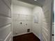 Conveniently located laundry room offers shelving and ample room at 144 Parker Ln, Mebane, NC 27302