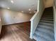 The living room leads to the stairway that goes to the second floor at 144 Parker Ln, Mebane, NC 27302