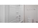 Clean bathroom with a tub-shower combo, a toilet, and a towel rack at 156 Paper Birch Way, Fuquay Varina, NC 27526