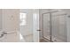 Bathroom highlighting a modern glass-enclosed shower and single sink vanity at 156 Paper Birch Way, Fuquay Varina, NC 27526