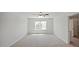 Spacious, naturally lit carpeted bedroom with a ceiling fan and an attached bathroom at 156 Paper Birch Way, Fuquay Varina, NC 27526