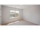 Bright bedroom with neutral carpet and a large window providing ample natural light at 156 Paper Birch Way, Fuquay Varina, NC 27526