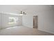 Light-filled bedroom with plush carpet, ceiling fan and a convenient ensuite bathroom at 156 Paper Birch Way, Fuquay Varina, NC 27526