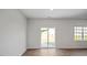 Bright living room with sliding glass doors leading to the patio at 156 Paper Birch Way, Fuquay Varina, NC 27526
