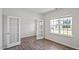 Bright office space with wood floors, double doors, and a large window offering natural light at 156 Paper Birch Way, Fuquay Varina, NC 27526