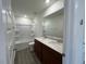 Bathroom featuring double sinks, a large mirror, and a shower-tub combination at 160 Parker Ln, Mebane, NC 27302