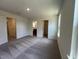 Spacious bedroom featuring neutral carpet, light-colored walls, and ample natural light at 160 Parker Ln, Mebane, NC 27302