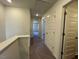 Hallway with carpet, open doorways and closet at 160 Parker Ln, Mebane, NC 27302