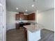 Well-lit kitchen with granite countertops, modern appliances, and ample cabinet space at 160 Parker Ln, Mebane, NC 27302