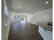 Spacious living room with hardwood floors, large windows, and sliding glass doors at 160 Parker Ln, Mebane, NC 27302