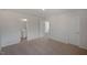 Bedroom showcasing multiple doorways and neutral carpet at 168 Paper Birch Way, Fuquay Varina, NC 27526