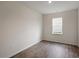 Inviting, empty room with wood floors, natural light, and neutral walls, ready for personalization at 168 Paper Birch Way, Fuquay Varina, NC 27526