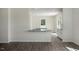Bright open floor plan with kitchen granite countertops and wood floors at 168 Paper Birch Way, Fuquay Varina, NC 27526