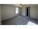 Spacious bedroom features tray ceiling, ceiling fan, and plush neutral carpeting at 175 Magnolia Run Way, Benson, NC 27504