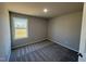 A well-lit bedroom features neutral paint and soft, patterned gray carpeting at 175 Magnolia Run Way, Benson, NC 27504