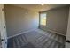 A bright bedroom features neutral paint and soft, patterned gray carpeting at 175 Magnolia Run Way, Benson, NC 27504