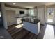 Modern kitchen with white cabinets, granite countertops, an island with a sink, and stainless steel appliances at 175 Magnolia Run Way, Benson, NC 27504