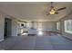 Open-concept layout connecting a living room, kitchen, and dining area, featuring a fireplace and hardwood floors at 175 Magnolia Run Way, Benson, NC 27504