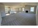 Open-concept layout connecting a living room, kitchen, and dining area, featuring a fireplace and hardwood floors at 175 Magnolia Run Way, Benson, NC 27504
