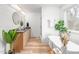 Bright modern bathroom with double vanity, luxurious tub, separate shower, and stylish decor at 206 Ellington Rd, Graham, NC 27253