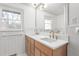 Bright bathroom showcasing a double vanity with quartz countertops at 206 Ellington Rd, Graham, NC 27253
