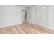 Spacious bedroom showcasing light wood flooring and modern white closet doors at 206 Ellington Rd, Graham, NC 27253