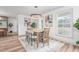 Bright dining area with a wooden table, stylish chairs, and a modern chandelier at 206 Ellington Rd, Graham, NC 27253