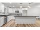 Bright kitchen featuring white cabinets, modern appliances, and an island at 206 Ellington Rd, Graham, NC 27253