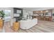 Spacious living room featuring modern decor, wood floors, and an inviting atmosphere for relaxation and gatherings at 206 Ellington Rd, Graham, NC 27253
