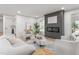 Modern living room featuring a fireplace, contemporary decor, and comfortable seating, creating a cozy and inviting space at 206 Ellington Rd, Graham, NC 27253