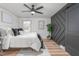 Main bedroom boasts a barn door and a decorative accent wall at 206 Ellington Rd, Graham, NC 27253