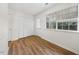 Bright, wood-look floor bedroom with a closet and windows offering ample natural light at 2146 Charles St # 29, Durham, NC 27707