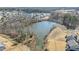 Scenic aerial view of the community pond surrounded by trees at 25 Bourne Dr, Franklinton, NC 27525