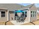 Backyard with a patio, grill, and outdoor dining set with a bright blue umbrella at 25 Bourne Dr, Franklinton, NC 27525