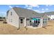 Well-maintained backyard featuring a patio with an outdoor dining area, perfect for entertaining guests at 25 Bourne Dr, Franklinton, NC 27525
