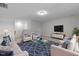 Inviting living room with comfortable seating, a modern coffee table, and a large television at 25 Bourne Dr, Franklinton, NC 27525