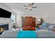 Inviting living room boasts a fireplace, ceiling fan, wood floors, and a stylish blue accent blanket at 25 Bourne Dr, Franklinton, NC 27525