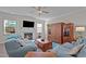 Comfortable living room with a fireplace, large TV, and cozy seating arrangement at 25 Bourne Dr, Franklinton, NC 27525