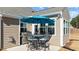 Outdoor patio area features a grill and seating with a blue umbrella for shade at 25 Bourne Dr, Franklinton, NC 27525