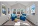 Bright sun room with vaulted ceiling and windows on three sides showcasing outdoor view at 25 Bourne Dr, Franklinton, NC 27525